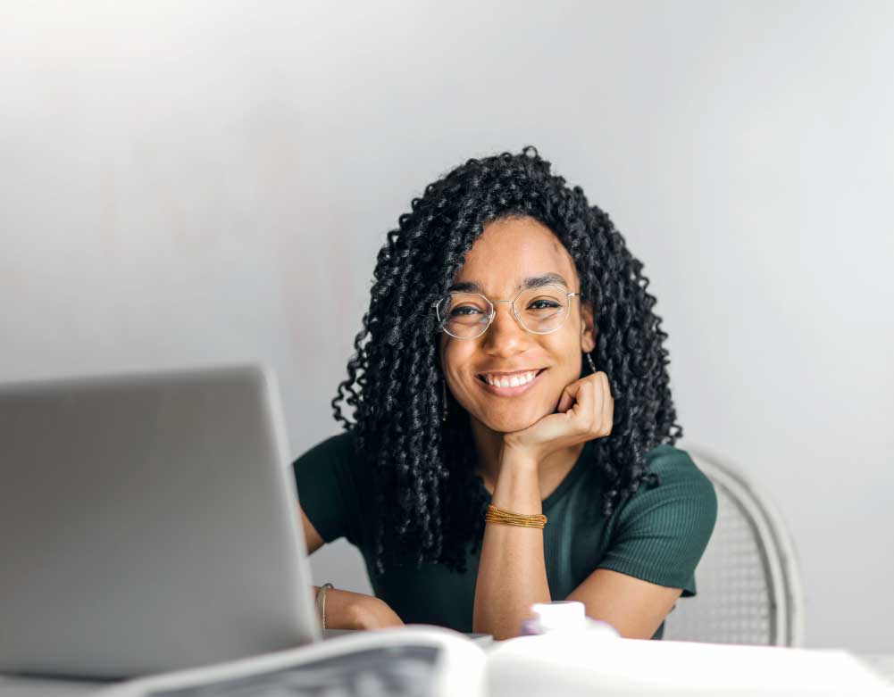 Woman sitting by computer