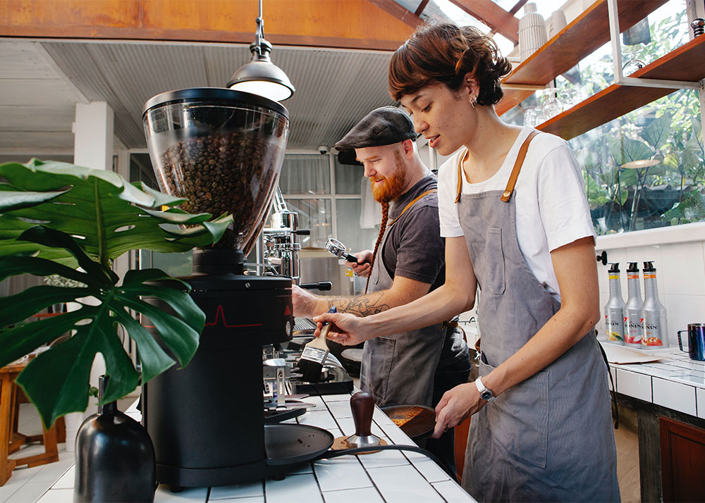 people working in a cafe